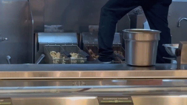 Panda Express guest stunned as employee stands on fryer while cleaning